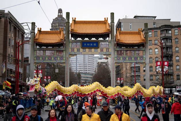 February 22, 2026, Vancouver, Bc, CANADA: A dragon dance passes through the Chinatown Millennium Gate during the annual Spring Festival Parade for the Lunar New Year in Vancouver, on Sunday, Feb. 22, 2026. Vancouver CANADA  - ZUMAc35_ 20260222_zaf_c35_167 Copyright: xEthanxCairnsx