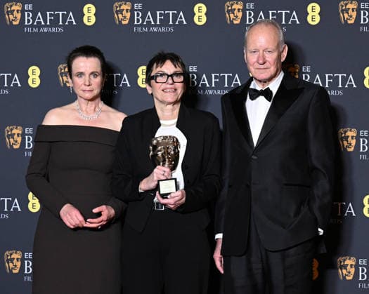 British actress Emily Watson, film producer Clare Binns and Swedish actor Stellan Skarsgard attend the Winners Room at the EE BAFTA Film Awards at the Royal Festival Hall in London, England on Sunday, February 22, 2026.  LON202602221111 RUNExHELLESTAD