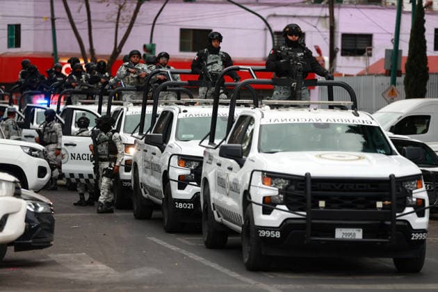 Security presence in Mexico City following killing of cartel leader El Mencho MEXICO CITY, MEXICO - FEBRUARY 22: Members of the National Guard stand guard outside the facilities of the Specialized Prosecutor s Office for Organized Crime (FEMDO) in Mexico City, Mexico on February 22, 2026. The security presence outside the FEMDO facilities follows an operation earlier in the day in which cartel leader Nemesio Oseguera Cervantes, known as El Mencho was killed during a military operation in Tapalpa, in the state of Jalisco, authorities confirmed. Daniel Cardenas Anadolu Mexico City Mexico. Editorial use only. Please get in touch for any other usage.  Copyright: x2026xAnadoluxDanielxCardenasx