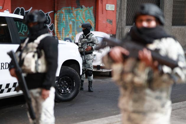 Security presence in Mexico City following killing of cartel leader El Mencho MEXICO CITY, MEXICO - FEBRUARY 22: Members of the National Guard stand guard outside the facilities of the Specialized Prosecutor s Office for Organized Crime (FEMDO) in Mexico City, Mexico on February 22, 2026. The security presence outside the FEMDO facilities follows an operation earlier in the day in which cartel leader Nemesio Oseguera Cervantes, known as El Mencho was killed during a military operation in Tapalpa, in the state of Jalisco, authorities confirmed. Daniel Cardenas Anadolu Mexico City Mexico. Editorial use only. Please get in touch for any other usage.  Copyright: x2026xAnadoluxDanielxCardenasx