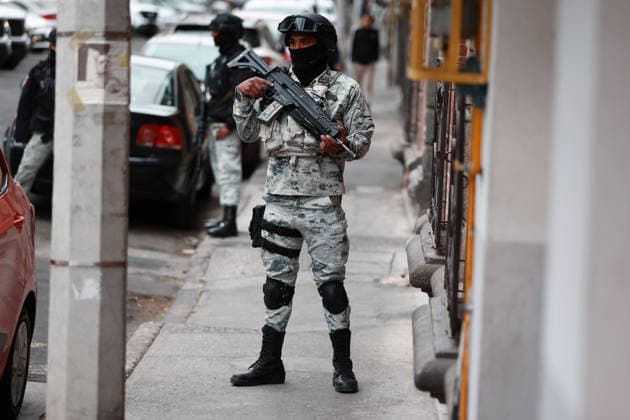 Security presence in Mexico City following killing of cartel leader El Mencho MEXICO CITY, MEXICO - FEBRUARY 22: Members of the National Guard stand guard outside the facilities of the Specialized Prosecutor s Office for Organized Crime (FEMDO) in Mexico City, Mexico on February 22, 2026. The security presence outside the FEMDO facilities follows an operation earlier in the day in which cartel leader Nemesio Oseguera Cervantes, known as El Mencho was killed during a military operation in Tapalpa, in the state of Jalisco, authorities confirmed. Daniel Cardenas Anadolu Mexico City Mexico. Editorial use only. Please get in touch for any other usage.  Copyright: x2026xAnadoluxDanielxCardenasx