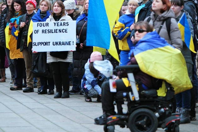 February 22, 2026, Vancouver, Bc, Canada: A woman holding Placard in Global Rally For Ukraine.Global Rally For Ukraine marking four years since Russia s full-scale invasion,taking place on February 22 at 2:00 PM at the vancouver Art Gallery. Vancouver Canada  - ZUMAa223 20260222_zip_a223_013 Copyright: xMazyarxAsadix
