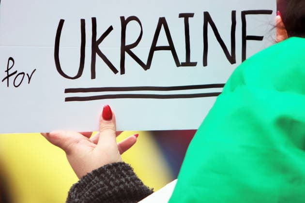 February 22, 2026, Vancouver, Bc, Canada: A woman holding Placard in Global Rally For Ukraine.Global Rally For Ukraine marking four years since Russia s full-scale invasion,taking place on February 22 at 2:00 PM at the vancouver Art Gallery. Vancouver Canada - ZUMAa223 20260222_zip_a223_031 Copyright: xMazyarxAsadix