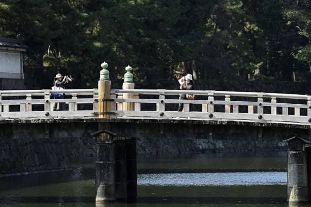 Japanese Emperor Naruhito’s 66th birthday TOKYO, JAPAN - FEBRUARY 23 : People are seen walking on a traditional bridge as they gathered to celebrate Japanese Emperor Naruhito s 66th birthday for a public appearance at the Imperial Palace in Tokyo, Japan on February 23, 2026. David Mareuil Anadolu Tokyo Japan. Editorial use only. Please get in touch for any other usage.  Copyright: x2026xAnadoluxDavidxMareuilx