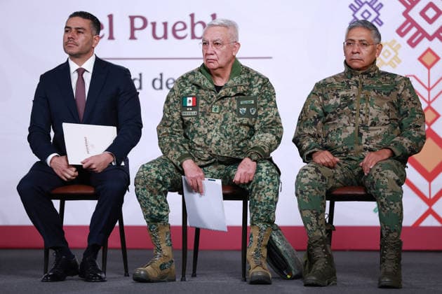 Mexico security cabinet details operation ending in death of cartel chief El Mencho MEXICO CITY, MEXICO - FEBRUARY 23: Secretary of Security and Citizen Protection Omar Garcia Harfuch (L) Mexico s Secretary of Defense Ricardo Trevilla (C) and Secretary of the Navy Raymundo Morales attend a press conference following the military operation in which cartel leader Nemesio Oseguera Cervantes, known as El Mencho was killed, at the National Palace, in Mexico City, Mexico on February 23, 2026. Daniel Cardenas Anadolu Mexico City Mexico. Editorial use only. Please get in touch for any other usage.  Copyright: x2026xAnadoluxDanielxCardenasx
