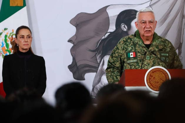 MexicoÃ¢â‚¬â ¢s President Claudia Sheinbaum Pardo is seen behind while Minister of Mexican National Defense, Ricardo Trevilla Trejo speaking during a news conference about the death of Nemesio Oseguera, know El Mencho, leader of the Jalisco Nueva Generacion Cartel, during an operation in Tapalpa, Jalisco, which sparked roadblocks and vehicle burnings in various parts of the country. on February 23, 2026 in Mexico City, Mexico. Mexico City Mexico - ZUMAe321 20260223_zia_e321_019 Copyright: xCarlosxSantiagox