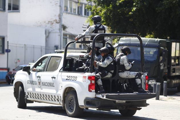 Security measures in Jalisco, Mexico amid volatile situation GUADALAJARA, MEXICO - FEBRUARY 23: Security elements patrol the streets in Guadalajara, Jalisco, on February 23, 2026. The Jalisco state government urged residents to remain at home, suspended public transportation, and activated a red alert amid threats to public safety following a military operation targeting the Jalisco New Generation Cartel in the town of Tapalpa, about 130 kilometers (80 miles) south of Guadalajara, the capital of Jalisco state. Stringer Anadolu Guadalajara Mexico. Editorial use only. Please get in touch for any other usage.  Copyright: x2026xAnadoluxStringerx