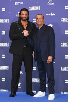 76th Italian Song Festival of Sanremo Photocall of 1st evening and 1st DopoFestival hosts Teatro Ariston Sanremo, Italy Can Yaman;Carlo Conti 76th Italian Song Festival of Sanremo Photocall of 1st evening and 1st DopoFestival hosts Teatro Ariston Sanremo, Italy 23rd February 2026 SGPItalia id 134399_008 Not Exclusive  Copyright: xALFONSOxCATALANO SGPITALIAx