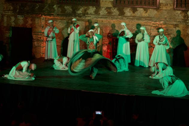 The traditional Ramadan custom Tennura dance in Egypt CAIRO, EGYPT - FEBRUARY 25: Tennura dance performances and Sufi music concerts are held daily throughout the holy month of Ramadan at Bayt al-Ghuri in Cairo on February 25, 2026. Wearing colorful skirts, embroidered vests, and white caps, Tennura performers spin around their axis while playing tambourines in rhythm with Sufi music, creating a vibrant and spiritual spectacle. Fareed Kotb Anadolu Cairo Egypt. Editorial use only. Please get in touch for any other usage.  Copyright: x2026xAnadoluxFareedxKotbx