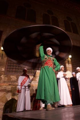 The traditional Ramadan custom Tennura dance in Egypt CAIRO, EGYPT - FEBRUARY 25: Tennura dance performances and Sufi music concerts are held daily throughout the holy month of Ramadan at Bayt al-Ghuri in Cairo on February 25, 2026. Wearing colorful skirts, embroidered vests, and white caps, Tennura performers spin around their axis while playing tambourines in rhythm with Sufi music, creating a vibrant and spiritual spectacle. Fareed Kotb Anadolu Cairo Egypt. Editorial use only. Please get in touch for any other usage.  Copyright: x2026xAnadoluxFareedxKotbx