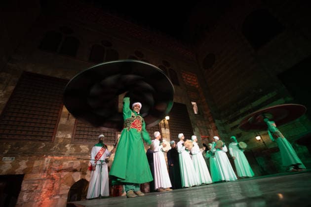 The traditional Ramadan custom Tennura dance in Egypt CAIRO, EGYPT - FEBRUARY 25: Tennura dance performances and Sufi music concerts are held daily throughout the holy month of Ramadan at Bayt al-Ghuri in Cairo on February 25, 2026. Wearing colorful skirts, embroidered vests, and white caps, Tennura performers spin around their axis while playing tambourines in rhythm with Sufi music, creating a vibrant and spiritual spectacle. Fareed Kotb Anadolu Cairo Egypt. Editorial use only. Please get in touch for any other usage.  Copyright: x2026xAnadoluxFareedxKotbx