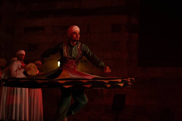 The traditional Ramadan custom Tennura dance in Egypt CAIRO, EGYPT - FEBRUARY 25: Tennura dance performances and Sufi music concerts are held daily throughout the holy month of Ramadan at Bayt al-Ghuri in Cairo on February 25, 2026. Wearing colorful skirts, embroidered vests, and white caps, Tennura performers spin around their axis while playing tambourines in rhythm with Sufi music, creating a vibrant and spiritual spectacle. Fareed Kotb Anadolu Cairo Egypt. Editorial use only. Please get in touch for any other usage.  Copyright: x2026xAnadoluxFareedxKotbx