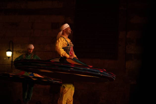 The traditional Ramadan custom Tennura dance in Egypt CAIRO, EGYPT - FEBRUARY 25: Tennura dance performances and Sufi music concerts are held daily throughout the holy month of Ramadan at Bayt al-Ghuri in Cairo on February 25, 2026. Wearing colorful skirts, embroidered vests, and white caps, Tennura performers spin around their axis while playing tambourines in rhythm with Sufi music, creating a vibrant and spiritual spectacle. Fareed Kotb Anadolu Cairo Egypt. Editorial use only. Please get in touch for any other usage.  Copyright: x2026xAnadoluxFareedxKotbx