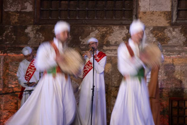 The traditional Ramadan custom Tennura dance in Egypt CAIRO, EGYPT - FEBRUARY 25: Tennura dance performances and Sufi music concerts are held daily throughout the holy month of Ramadan at Bayt al-Ghuri in Cairo on February 25, 2026. Wearing colorful skirts, embroidered vests, and white caps, Tennura performers spin around their axis while playing tambourines in rhythm with Sufi music, creating a vibrant and spiritual spectacle. Fareed Kotb Anadolu Cairo Egypt. Editorial use only. Please get in touch for any other usage.  Copyright: x2026xAnadoluxFareedxKotbx