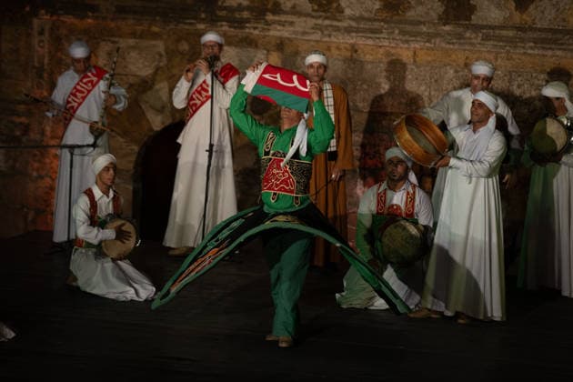 The traditional Ramadan custom Tennura dance in Egypt CAIRO, EGYPT - FEBRUARY 25: Tennura dance performances and Sufi music concerts are held daily throughout the holy month of Ramadan at Bayt al-Ghuri in Cairo on February 25, 2026. Wearing colorful skirts, embroidered vests, and white caps, Tennura performers spin around their axis while playing tambourines in rhythm with Sufi music, creating a vibrant and spiritual spectacle. Fareed Kotb Anadolu Cairo Egypt. Editorial use only. Please get in touch for any other usage.  Copyright: x2026xAnadoluxFareedxKotbx