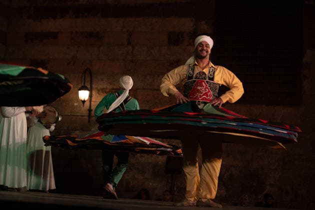 The traditional Ramadan custom Tennura dance in Egypt CAIRO, EGYPT - FEBRUARY 25: Tennura dance performances and Sufi music concerts are held daily throughout the holy month of Ramadan at Bayt al-Ghuri in Cairo on February 25, 2026. Wearing colorful skirts, embroidered vests, and white caps, Tennura performers spin around their axis while playing tambourines in rhythm with Sufi music, creating a vibrant and spiritual spectacle. Fareed Kotb Anadolu Cairo Egypt. Editorial use only. Please get in touch for any other usage.  Copyright: x2026xAnadoluxFareedxKotbx
