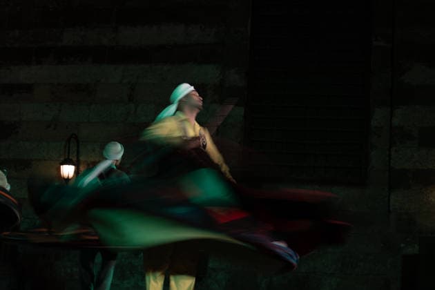 The traditional Ramadan custom Tennura dance in Egypt CAIRO, EGYPT - FEBRUARY 25: Tennura dance performances and Sufi music concerts are held daily throughout the holy month of Ramadan at Bayt al-Ghuri in Cairo on February 25, 2026. Wearing colorful skirts, embroidered vests, and white caps, Tennura performers spin around their axis while playing tambourines in rhythm with Sufi music, creating a vibrant and spiritual spectacle. Fareed Kotb Anadolu Cairo Egypt. Editorial use only. Please get in touch for any other usage.  Copyright: x2026xAnadoluxFareedxKotbx