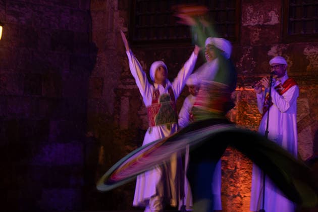 The traditional Ramadan custom Tennura dance in Egypt CAIRO, EGYPT - FEBRUARY 25: Tennura dance performances and Sufi music concerts are held daily throughout the holy month of Ramadan at Bayt al-Ghuri in Cairo on February 25, 2026. Wearing colorful skirts, embroidered vests, and white caps, Tennura performers spin around their axis while playing tambourines in rhythm with Sufi music, creating a vibrant and spiritual spectacle. Fareed Kotb Anadolu Cairo Egypt. Editorial use only. Please get in touch for any other usage.  Copyright: x2026xAnadoluxFareedxKotbx