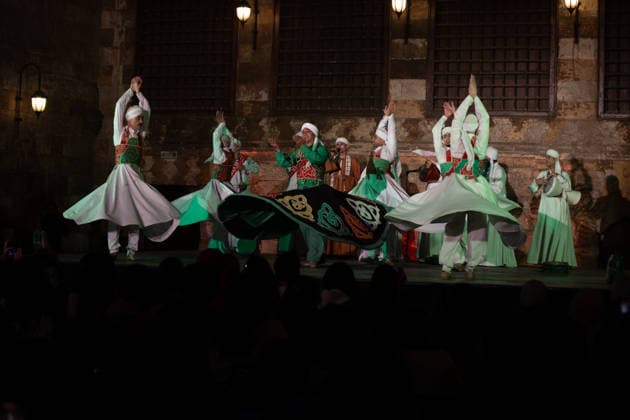 The traditional Ramadan custom Tennura dance in Egypt CAIRO, EGYPT - FEBRUARY 25: Tennura dance performances and Sufi music concerts are held daily throughout the holy month of Ramadan at Bayt al-Ghuri in Cairo on February 25, 2026. Wearing colorful skirts, embroidered vests, and white caps, Tennura performers spin around their axis while playing tambourines in rhythm with Sufi music, creating a vibrant and spiritual spectacle. Fareed Kotb Anadolu Cairo Egypt. Editorial use only. Please get in touch for any other usage.  Copyright: x2026xAnadoluxFareedxKotbx