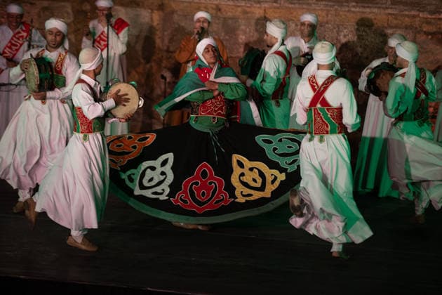The traditional Ramadan custom Tennura dance in Egypt CAIRO, EGYPT - FEBRUARY 25: Tennura dance performances and Sufi music concerts are held daily throughout the holy month of Ramadan at Bayt al-Ghuri in Cairo on February 25, 2026. Wearing colorful skirts, embroidered vests, and white caps, Tennura performers spin around their axis while playing tambourines in rhythm with Sufi music, creating a vibrant and spiritual spectacle. Fareed Kotb Anadolu Cairo Egypt. Editorial use only. Please get in touch for any other usage.  Copyright: x2026xAnadoluxFareedxKotbx
