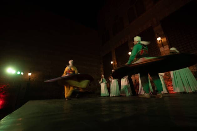 The traditional Ramadan custom Tennura dance in Egypt CAIRO, EGYPT - FEBRUARY 25: Tennura dance performances and Sufi music concerts are held daily throughout the holy month of Ramadan at Bayt al-Ghuri in Cairo on February 25, 2026. Wearing colorful skirts, embroidered vests, and white caps, Tennura performers spin around their axis while playing tambourines in rhythm with Sufi music, creating a vibrant and spiritual spectacle. Fareed Kotb Anadolu Cairo Egypt. Editorial use only. Please get in touch for any other usage.  Copyright: x2026xAnadoluxFareedxKotbx