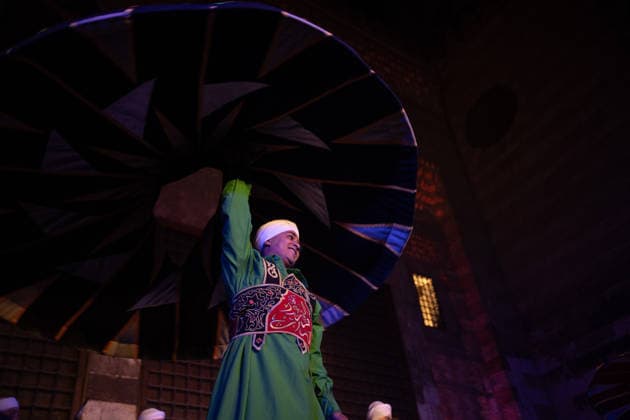 The traditional Ramadan custom Tennura dance in Egypt CAIRO, EGYPT - FEBRUARY 25: Tennura dance performances and Sufi music concerts are held daily throughout the holy month of Ramadan at Bayt al-Ghuri in Cairo on February 25, 2026. Wearing colorful skirts, embroidered vests, and white caps, Tennura performers spin around their axis while playing tambourines in rhythm with Sufi music, creating a vibrant and spiritual spectacle. Fareed Kotb Anadolu Cairo Egypt. Editorial use only. Please get in touch for any other usage.  Copyright: x2026xAnadoluxFareedxKotbx