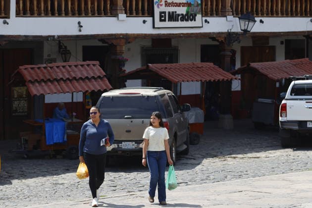 Life in Tapalpa after military operation that killed cartel leader El Mencho TAPALPA, MEXICO - FEBRUARY 25: People walk through the streets of the Tapalpa town center after a military operation that killed cartel leader Nemesio Oseguera, El Mencho , in Tapalpa, Mexico. on February 25, 2026. Stringer Anadolu Tapalpa Mexico. Editorial use only. Please get in touch for any other usage.  Copyright: x2026xAnadoluxStringerx