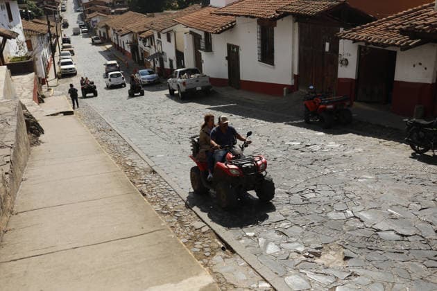 Life in Tapalpa after military operation that killed cartel leader El Mencho TAPALPA, MEXICO - FEBRUARY 25: People walk through the streets of the Tapalpa town center after a military operation that killed cartel leader Nemesio Oseguera, El Mencho , in Tapalpa, Mexico. on February 25, 2026. Stringer Anadolu Tapalpa Mexico. Editorial use only. Please get in touch for any other usage.  Copyright: x2026xAnadoluxStringerx