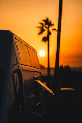 Sunset view with camper van in Galicia, Spain A tranquil evening in Galicia, Spain, with a camper van parked by the beach. The golden sunset illuminates the sky, creating a serene silhouette of palm trees and ocean waves. Model Released AlvaroMontero_ID33214_1131240_006 Copyright: xAlvaroxMonterox RECORD DATE NOT STATED