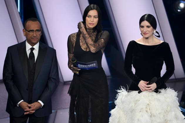 February 26, 2026, Sanremo, Italy: (L-R) Sanremo Festival host and artistic director Carlo Conti with Russian model Irina Shayk and Italian singers Laura Pausini on stage at the Ariston theatre during the 76th edition of the Sanremo Italian Song Festival, in Sanremo, Italy, 26 February 2026. The music festival will run from 24 to 28 February 2026. ANSA ETTORE FERRARI. Sanremo Italy  - ZUMAa110 20260226_zaf_a110_130 Copyright: xEttorexFerrarix