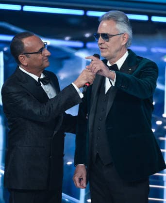 February 28, 2026, Sanremo, ITALY: (L-R) Sanremo Festival host and artistic director Carlo Conti and Italian tenor Andrea Bocelli performs on stage at the Ariston theatre during the 76th edition of the Sanremo Italian Song Festival, in Sanremo, Italy, 28 February 2026. The Music Festival runs from 24 to 28 February 2026. ANSA ETTORE FERRARI Sanremo ITALY  - ZUMAa110 20260228_zaf_a110_220 Copyright: xEttorexFerrarix