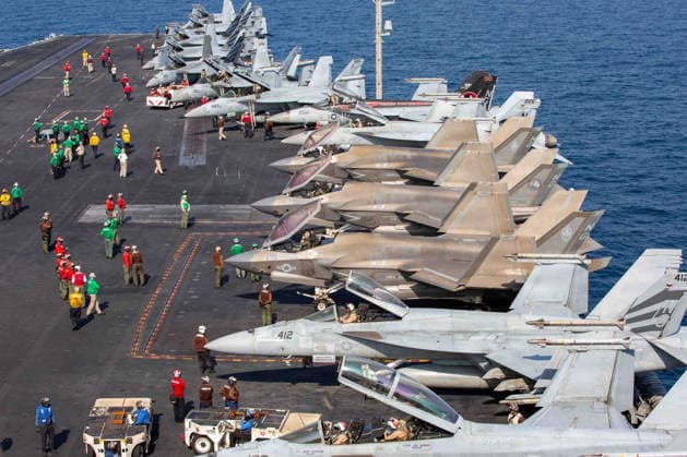 March 1, 2026, Undisclosed Location, United States: U.S. Navy and Marine fighter aircraft with Carrier Air Wing 9 are stacked along the flight deck of the Nimitz-class aircraft carrier USS Abraham Lincoln during Operation Epic Fury, February 28, 2026, from an undisclosed location. The United States and Israel launched joint strikes on Iran. Undisclosed Location United States - ZUMAp138 20260301_zaa_p138_003 Copyright: xMsgt.xKulanixLakanaria U.S.xNavyx