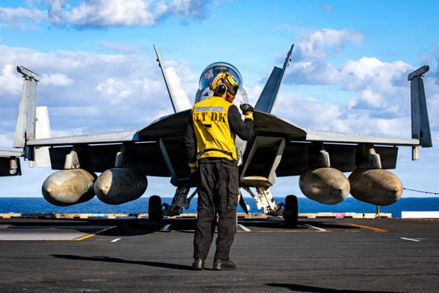 News Themen der Woche KW09 March 1, 2026, Uss Gerald R Ford, International Waters: A U.S. Navy sailor signals a F A-18F Super Hornet aircraft, attached to the Tomcatters of Strike Fighter Squadron 31, to hold during taxi on the flight deck of the Ford-class aircraft carrier USS Gerald R. Ford operating in support of Operation Epic Fury, February 28, 2025, in an undisclosed location. Operation Epic Fury is the joint U.S-Israel attack on Iran. Uss Gerald R Ford International Waters - ZUMAp138 20260301_zaa_p138_056 Copyright: xUsxNavy U.SxNavyx