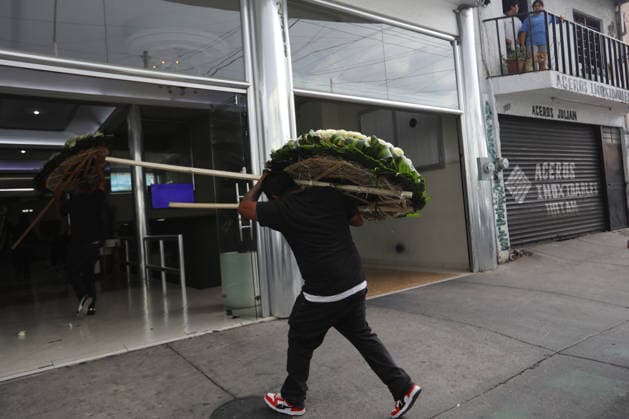 Funeral preparations are underway, believed to be for the slain cartel leader El Mencho in Guadalajara GUADALAJARA, MEXICO - MARCH 1: Employees unload a floral arrangement outside the La Paz funeral home as Mexican Army members take security measures near the funeral home, where the body of Nemesio Oseguera Cervantes, the leader of the Jalisco New Generation Cartel (CJNG) known as El Mencho , is believed to be located in Guadalajara, Jalisco, Mexico, on March 1, 2026. Stringer Anadolu Guadalajara Mexico. Editorial use only. Please get in touch for any other usage.  Copyright: x2026xAnadoluxStringerx