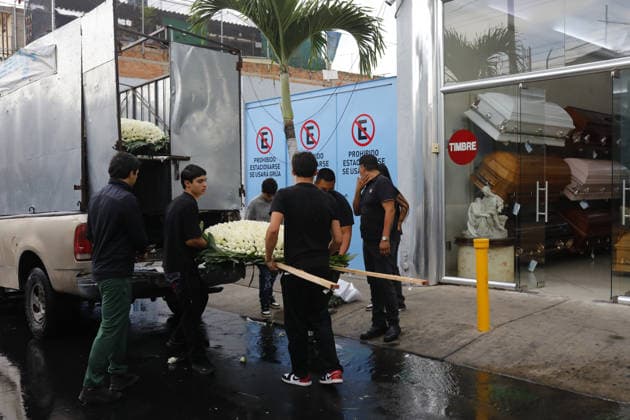 Funeral preparations are underway, believed to be for the slain cartel leader El Mencho in Guadalajara GUADALAJARA, MEXICO - MARCH 1: Employees unload a floral arrangement outside the La Paz funeral home as Mexican Army members take security measures near the funeral home, where the body of Nemesio Oseguera Cervantes, the leader of the Jalisco New Generation Cartel (CJNG) known as El Mencho , is believed to be located in Guadalajara, Jalisco, Mexico, on March 1, 2026. Stringer Anadolu Guadalajara Mexico. Editorial use only. Please get in touch for any other usage.  Copyright: x2026xAnadoluxStringerx