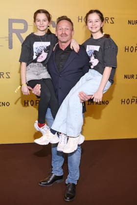 01 03 2026, Markus Ertelt with daughters Mina and Elena at the exclusive special screening of the fast-paced animated adventure Hoppers, Zoopalast, Berlin, Berlin Germany, Germany