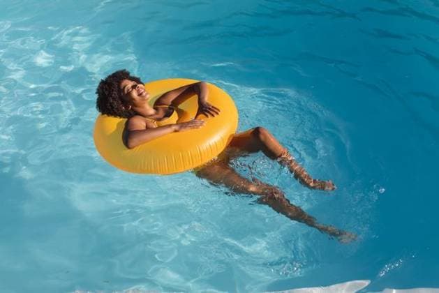 Mixed race woman sunbathing on inflatable in swimming pool Mixed race woman sunbathing on inflatable in swimming pool. Hanging out and relaxing outdoors in summer., model released, , property released, Cape Town, South Africa, 14.01.2021, 1405023.jpg, people,mixed race,woman,sunbathing,inflatable,swimming pool,hanging,relaxing,outdoors,summer,nature,landscape,outdoor,travel,vacation,beautiful,water,sky,green,beach,sea,park,spring,sunny,day,tourism,natural,leisure,lifestyle,sun,mixed,race,swimming,pool Young Adult,Woman,Female,Black