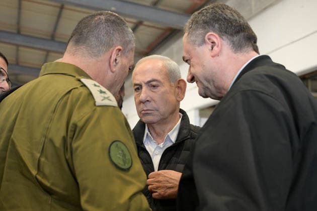 March 3, 2026, Palmachim Airbase, Israel: Israeli Prime Minister BENJAMIN NETANYAHU (C) visits the Palmachim Airbase accompanied by Minister of Defense ISRAEL KATZ (R) and IDF Chief of Staff Lt. Gen. EYAL ZAMIR (L). The Prime Minister received an operational briefing and held a conversation with UAV operators and with the technical teams, praising them for their accomplishments in Operation Roaring Lion. Palmachim Airbase Israel - ZUMAi99_ 20260303_zip_i99_001 Copyright: xMaayanxToaf IsraelxGpox