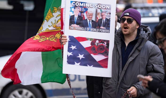 March 4, 2026, Montreal, Pq, CANADA: Demonstrators show support for military intervention in Iran by the United States and Israel during a rally in front of the U.S. Consulate in Montreal on Wednesday, March 4, 2026. Montreal CANADA  - ZUMAc35_ 20260304_zaf_c35_089 Copyright: xChristinnexMuschix