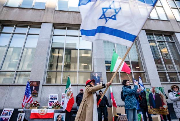 March 4, 2026, Montreal, Pq, CANADA: Demonstrators show support for military intervention in Iran by the United States and Israel during a rally in front of the U.S. Consulate in Montreal on Wednesday, March 4, 2026. Montreal CANADA  - ZUMAc35_ 20260304_zaf_c35_093 Copyright: xChristinnexMuschix