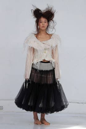 PFW - Reverie by Caroline Hu Runway A model walks the runway during the Reverie by Caroline Hu Womenswear Fall Winter 2026-2027 show as part of Paris Fashion Week on March 04, 2026 in Paris, France. Photo by Alain Gil Gonzalez ABACAPRESS.COM Paris France  Copyright: xGonzalezxAlain-Gil ABACAx