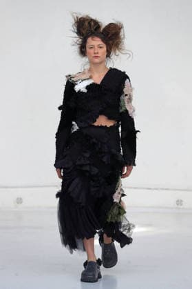 PFW - Reverie by Caroline Hu Runway A model walks the runway during the Reverie by Caroline Hu Womenswear Fall Winter 2026-2027 show as part of Paris Fashion Week on March 04, 2026 in Paris, France. Photo by Alain Gil Gonzalez ABACAPRESS.COM Paris France  Copyright: xGonzalezxAlain-Gil ABACAx