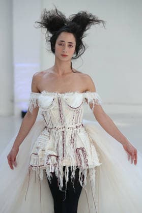 PFW - Reverie by Caroline Hu Runway A model walks the runway during the Reverie by Caroline Hu Womenswear Fall Winter 2026-2027 show as part of Paris Fashion Week on March 04, 2026 in Paris, France. Photo by Alain Gil Gonzalez ABACAPRESS.COM Paris France  Copyright: xGonzalezxAlain-Gil ABACAx