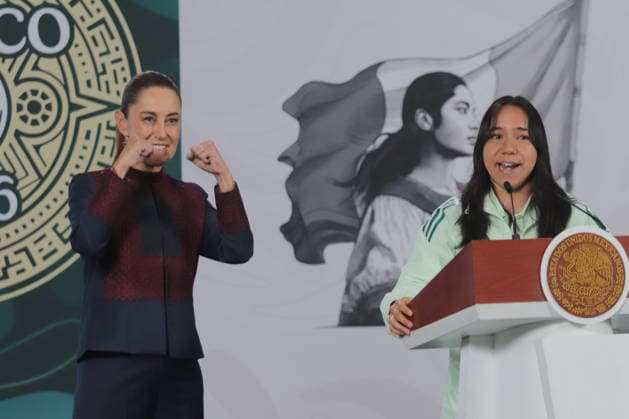 Mexico s President Claudia Sheinbaum is seen behind gesticulating as Charlyn Corral Ang, professional soccer player speaking during a briefing on the contest Represent Mexico at the Opening of the 2026 FIFA World Cup, through the so-called President s ticket at National Palace. on March 5, 2026 in Mexico City, Mexico. Mexico City Mexico  - ZUMAe321 20260305_zia_e321_012 Copyright: xCarlosxSantiagox