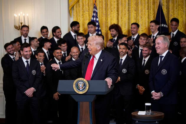 US President Donald Trump talks with captain Lionel Messi alongside members of Major League Soccer (MLS) champions Inter Miami CF during an event in the East Room of the White House on Thursday, March 5, 2026 in Washington, DC.  WAX20260305903 YurixGripas