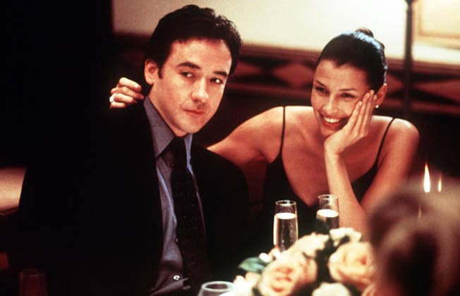 Serendipity Movie Stills Oct 05, 2001; Los Angeles, CA, USA; Actor JOHN CUSACK stars as Jonathan Trager and BRIDGET MOYNAHAN as Halley Buchanan in the Tapestry Films romantic comedy, Serendipity. Los Angeles CA USA Copyright: xTapestryxFilmsx