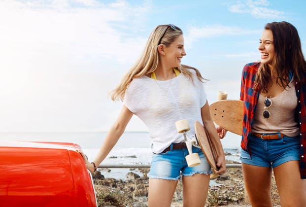 Road trip, skateboard and smile with women on beach together for holiday, travel or vacation. Adventure, car and coast with excited skater girls outdoor for bonding, tourism hobby or transportation. model released property released Copyright: xx