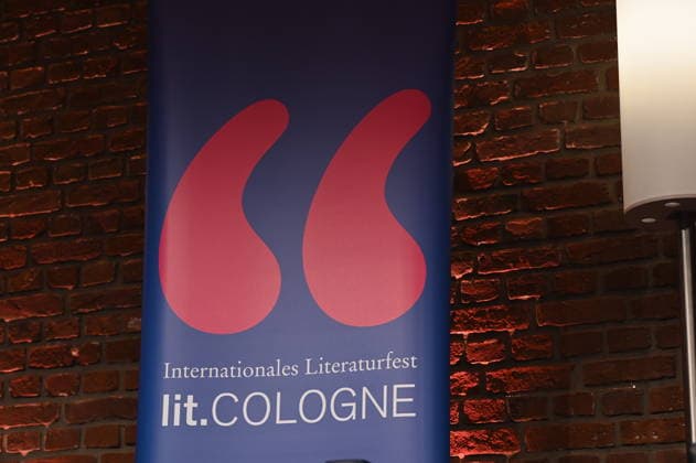 Stand with the logo and lettering of Lit Cologne, the international literature festival