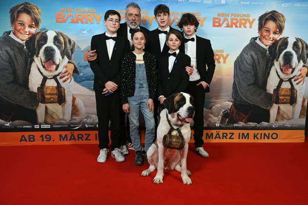 Actors Mael Gallati, Lino Good, Maxim Kämpf, Alma Büchenbacher, Paco von Wyss as Georg, director Markus Welter with St. Bernard Barry come to the film premiere of Mein Freund Barry at the Cinedom in Cologne