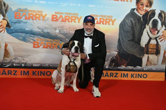St. Bernard Barry and director Markus Welter attend the premiere of the film Mein Freund Barry at the Cinedom in Cologne